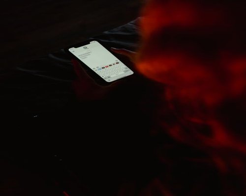 Smartphone with dim brightness setting in a dark room